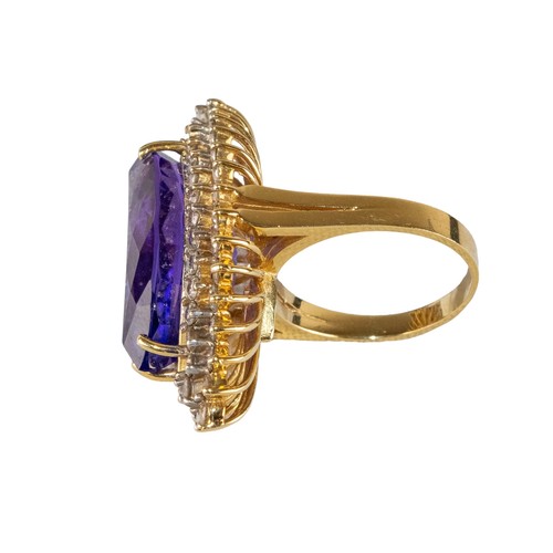 41 - AmericanCirca 1990An impressive tanzanite and diamond dress ringThe marquise shaped tanzanite weighi... 