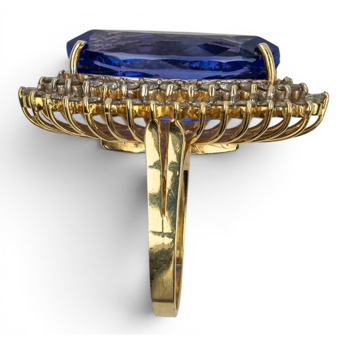 41 - AmericanCirca 1990An impressive tanzanite and diamond dress ringThe marquise shaped tanzanite weighi... 