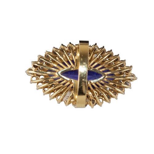 41 - AmericanCirca 1990An impressive tanzanite and diamond dress ringThe marquise shaped tanzanite weighi... 