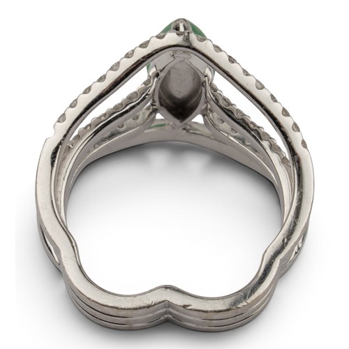 44 - A fine jadeite and diamond cluster dress ringThe central marquise-shaped highly translucent emerald ... 
