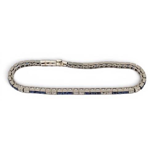 48 - Cartier, Paris, A fine calibre-cut sapphire and diamond line braceletDesigned as alternate rows of t... 