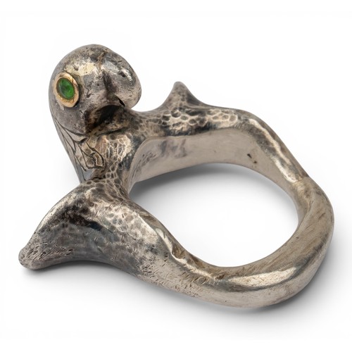 47 - Mosheh Oved, A silver and gold parrot ring, circa 1950The neck modelled and engraved to display plum... 