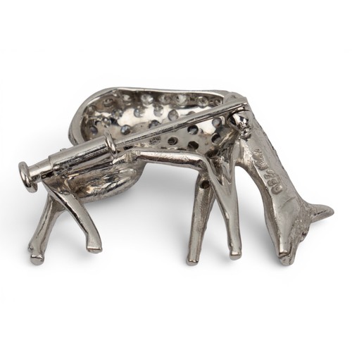 50 - A small platinum, diamond and ruby roe deer broochRealistically modelled and pavé-set throughout wit... 