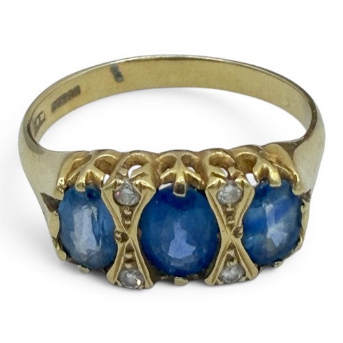 16A - A sapphire, diamond and 18ct gold three-stone ringThe three lightly graduated oval-shaped mixed-cut ... 