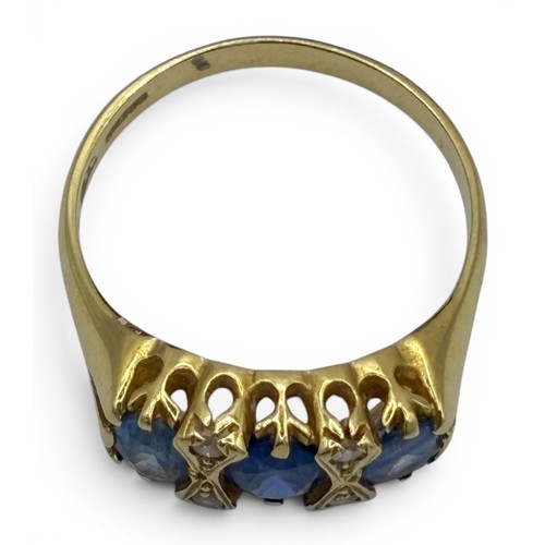 16A - A sapphire, diamond and 18ct gold three-stone ringThe three lightly graduated oval-shaped mixed-cut ... 