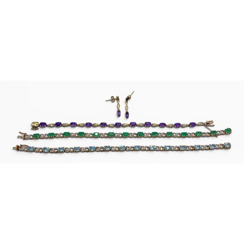 7A - Three bracelets and a pair of earringsTo include a 9ct gold and blue topaz bracelet, set with small ... 