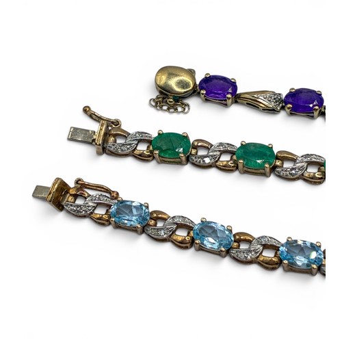 7A - Three bracelets and a pair of earringsTo include a 9ct gold and blue topaz bracelet, set with small ... 