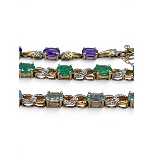 7A - Three bracelets and a pair of earringsTo include a 9ct gold and blue topaz bracelet, set with small ... 