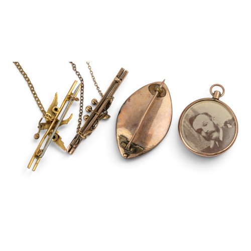 5 - Georgian, A split pearl and gold memorial hair brooch, of navette shape. Together with a yellow gold... 