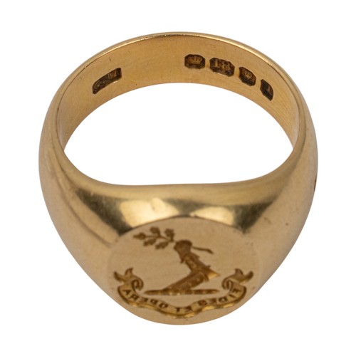 22 - An 18ct yellow gold signet ringWith family crest and 'Fides et Opera' motto engraved to the topFinge... 