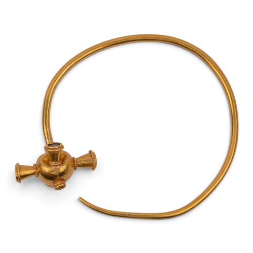 40 - Antique, A high-cart gold Byzantine style bangleThe plain wire bangle with a cross-shaped gem-set an... 