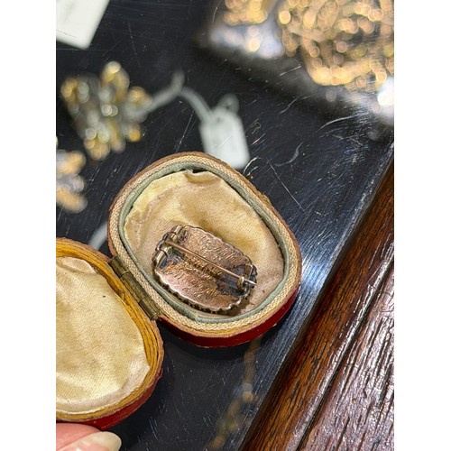 27 - Georgian, A diamond-set memorial brooch in original caseThe oval-shaped glazed plaited hair, within ... 