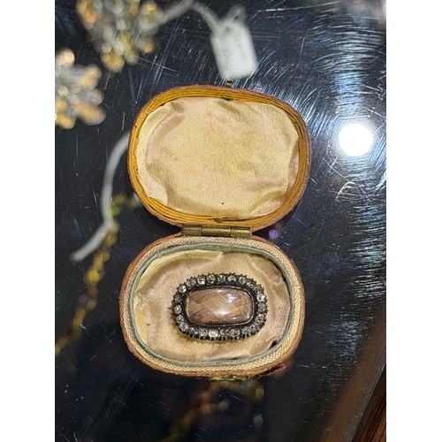 27 - Georgian, A diamond-set memorial brooch in original caseThe oval-shaped glazed plaited hair, within ... 