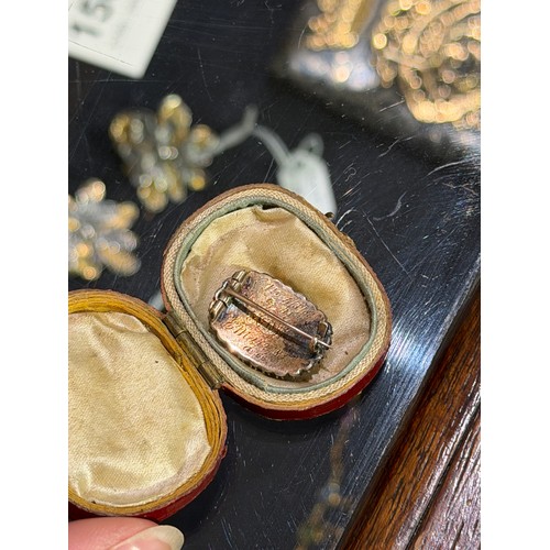 27 - Georgian, A diamond-set memorial brooch in original caseThe oval-shaped glazed plaited hair, within ... 