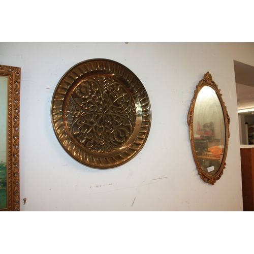 127 - Gilt Framed Oval Wall Mirror and a Circular Brass Charger