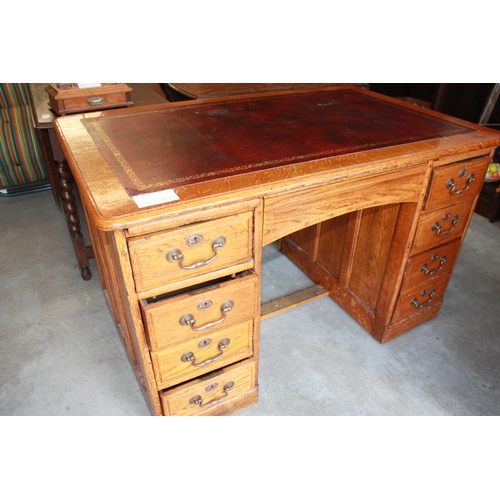 145 - Oak Twin Pedestal Nine-Drawer Desk with Red Leather Inlay