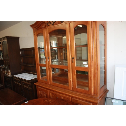 100 - Pine Back-Lit Display Cabinet having Glazed Three-Door Top Section over Two Cupboards flanking Three... 