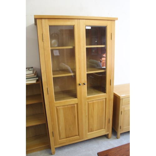 9 - Light Solid Oak Bookcase having Full-Length Part-Glazed Doors - approx. 40