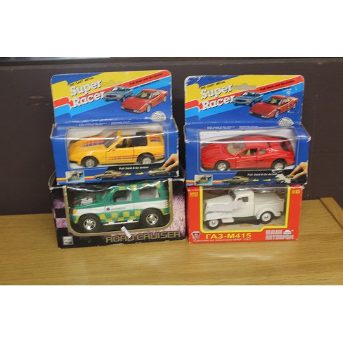 120 - One Boxed Paramedic Road Cruiser, Two Boxed Super Cars and One Russian 4 x 4 (all MIB)