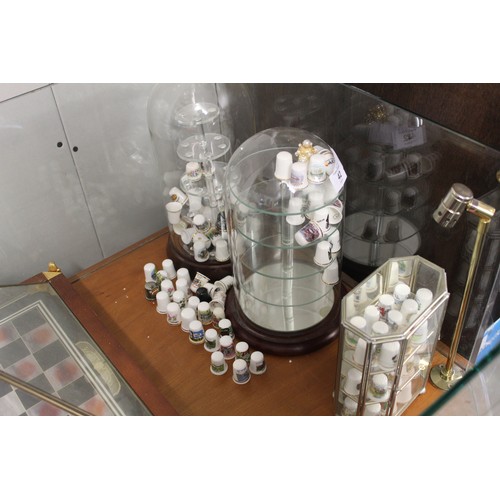 42 - Collection of approximately 100 Thimbles under Three Glass Domes