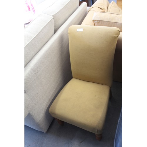 213 - An Upholstered Nursing Chair on short turned legs