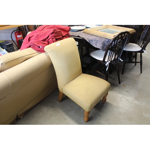 213 - An Upholstered Nursing Chair on short turned legs