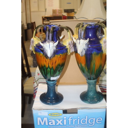 28 - Pair of Tall Majolica Urns adorned with Four Handles supported by Goats Heads - approx 18