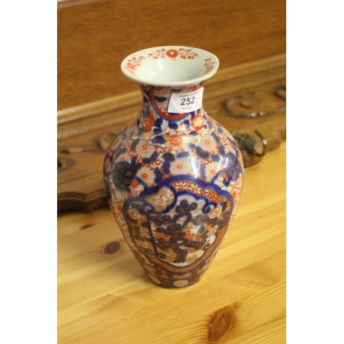 23 - Imari-style Vase in Blues, Reds on a white ground approximately 10