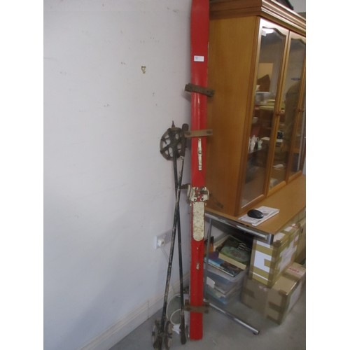 61 - One Pair of Vintage Skis in Red with Bamboo Poles with Leather Fittings