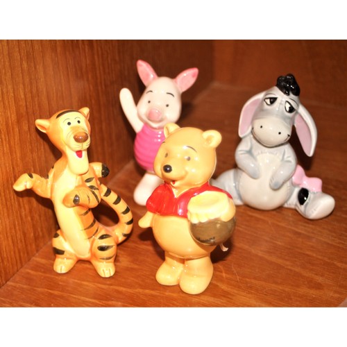 128 - Collection of Disney Winnie the Pooh Porcelain Figures:  Eyore Donkey, Piglet, Tigger and Pooh Bear