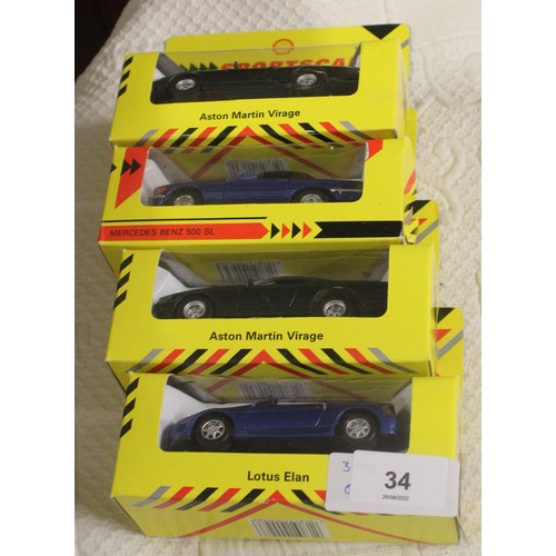 34 - Four Boxed Shell Promotional Sports Cars:  Aston Martin Virage (x 2), Mercedes Benz 500SL, and a Lot... 