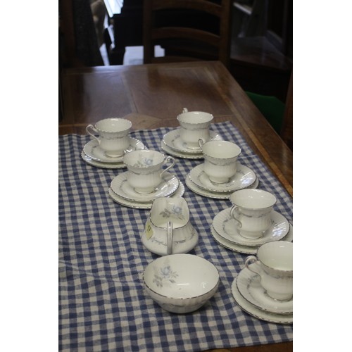 58 - A Six-Place Setting Paragon China Tea Set in the 