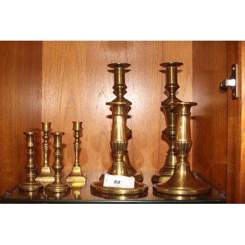 89 - Four Pairs of Brass Candle Sticks in Various Sizes (4