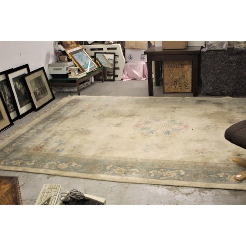 66 - Large Chinese Rug on a cream ground with pale Blue and Pink Floral Designs (12 Ft x 9 Ft) - needs cl... 