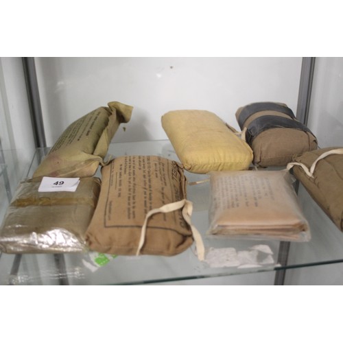 49 - Box of approximately 7 WWII Shell Dressings