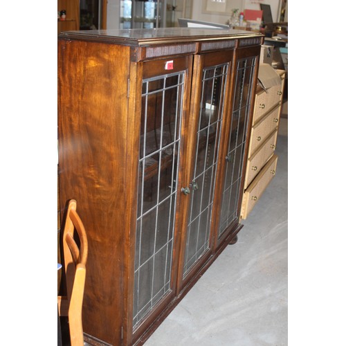 214 - Early Art Deco Oak Three Door Glazed Display Cabinet having Bakelite Handles all on Bun Feet
48