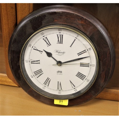 33 - A Belgravia Carriage Clock Company Quartz Clock in a Wooden Frame