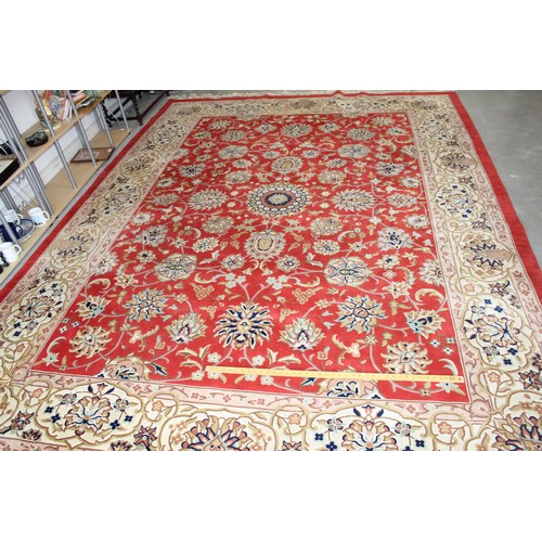 199 - 12.5' x 9' Fringed Chinese Style Rug having floral patterns in Reds, Creams, Blues and Pink on a Red... 