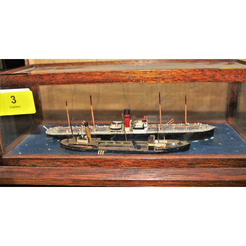 3 - Cased Model of a Cargo Ship having Red Funnell with Two Black Bands and Tender - 10.5