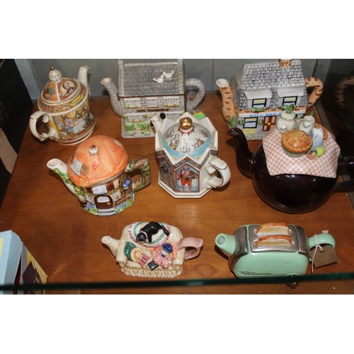 80 - Eight Ornamental Teapots including Three Designed by Annie Rowe (