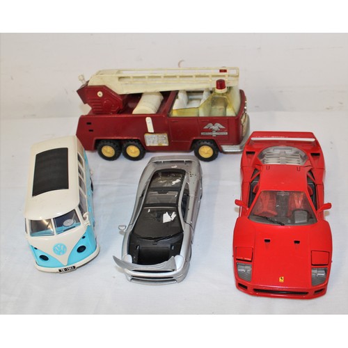 233 - Four Large Scale Plastic/Die-cast Cars