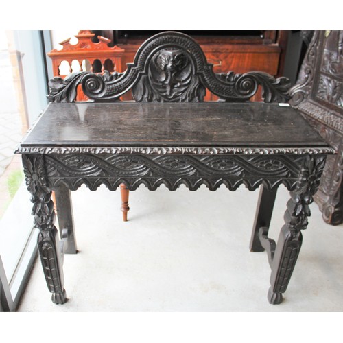 162 - Dark Oak Jacobean Style Carved  Reception Table with Ornate Scrolled Back