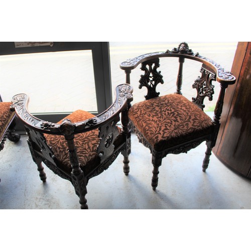 253 - A His and Hers Matching Pair of Ornately Carved Oak Corner Chairs