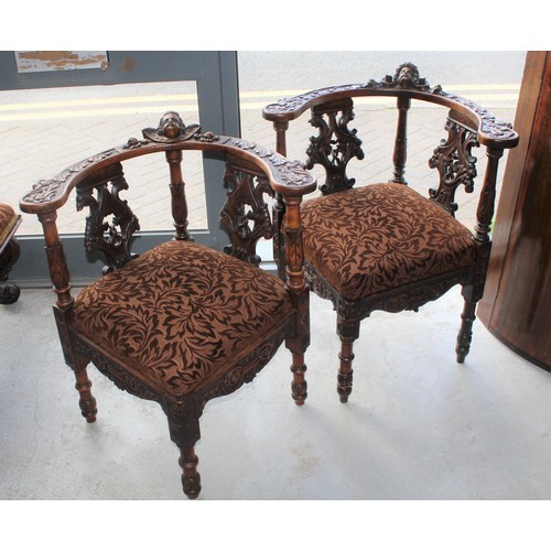 253 - A His and Hers Matching Pair of Ornately Carved Oak Corner Chairs