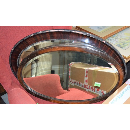 200 - Two Bevelled Edged Oval Wall Mirrors - One n/a