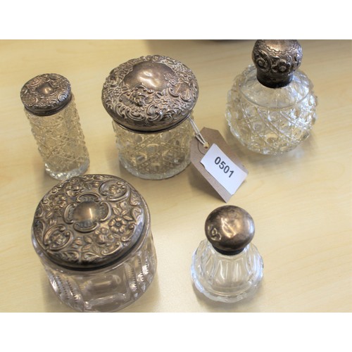 16 - Five Repousse Silver-Topped Vanity Bottles - Birmingham and London Hallmarks