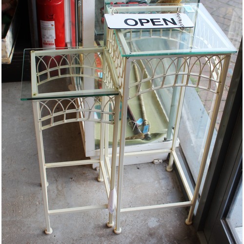 112 - Two Metal Conservatory Pedestal Tables having Glass Tops