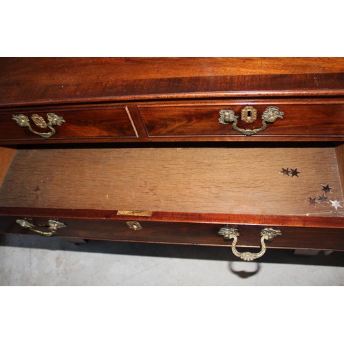 10 - A Mahogany Georgian Chest having two short drawers over three wide drawers having drop-handles - all... 