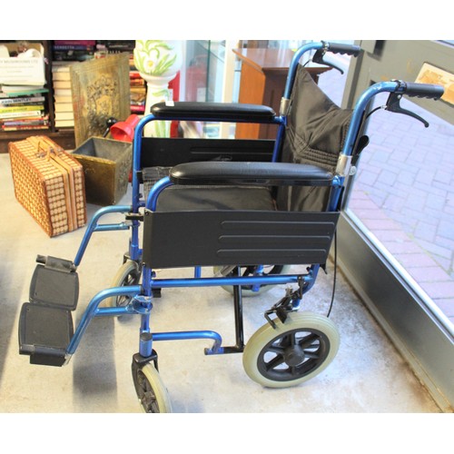 102 - Folding Wheelchair
(Two Pictures)