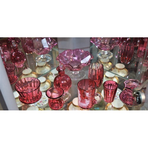 59 - Eight Pieces of Cranberry Glass including One Hand Decorated Mug, a Bon-Bon Dish, Scent Bottle, Bowl... 